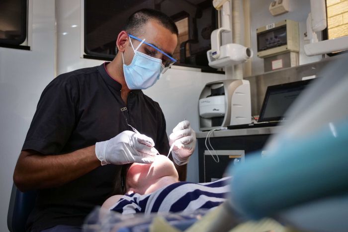 Dental care requires federally funded universal system, health experts say